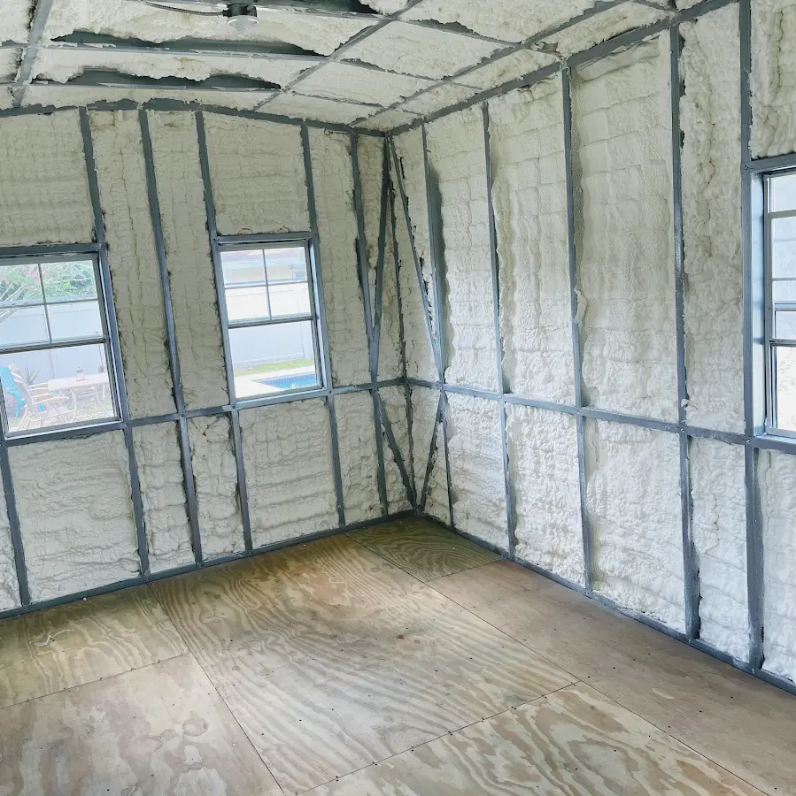 Closed-cell spray foam insulation applied to wall cavities in a residential project in Leighton